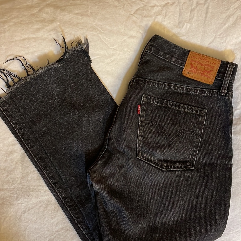 Levi’s 501 Tapered mid-rise Black wash Distressed jeans